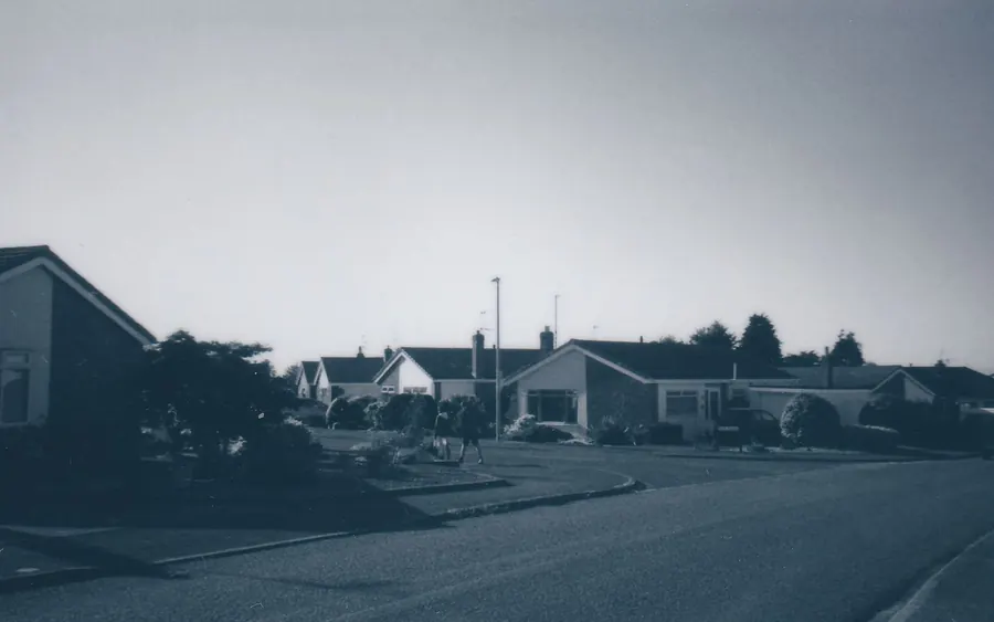 Street of hipped and gabled bungalows on a quiet estate, the type of housing where a hip-to-gable loft conversion in Cornwall can add a full upper floor