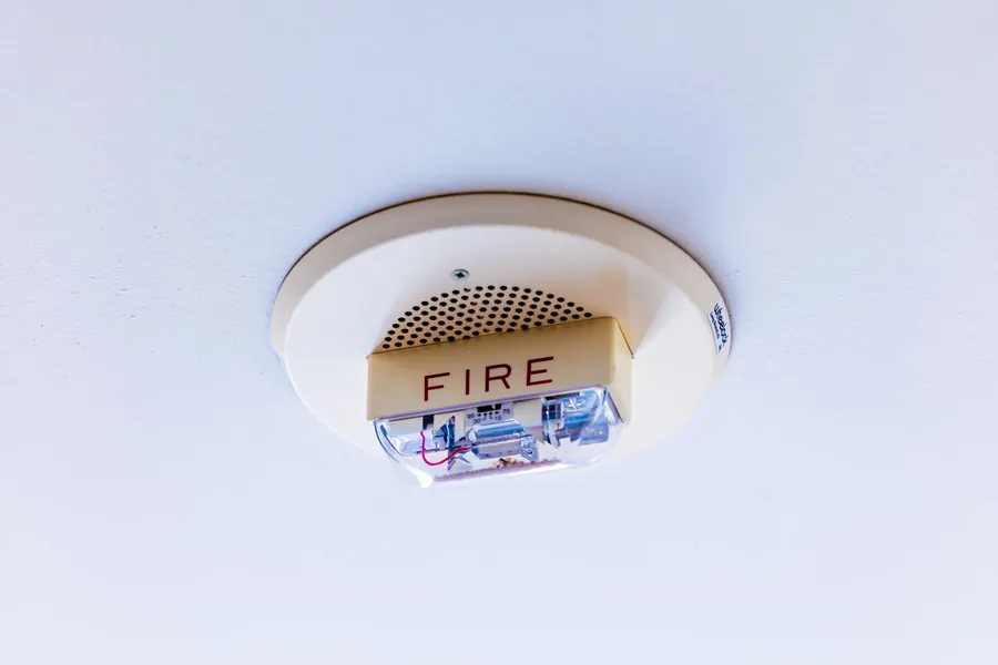 Ceiling mounted fire detection unit, part of the fire safety fit out required in a Cornish holiday let