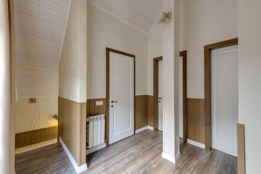 Landing with doors opening onto a loft conversion stairway, where fire doors are required down to the final exit