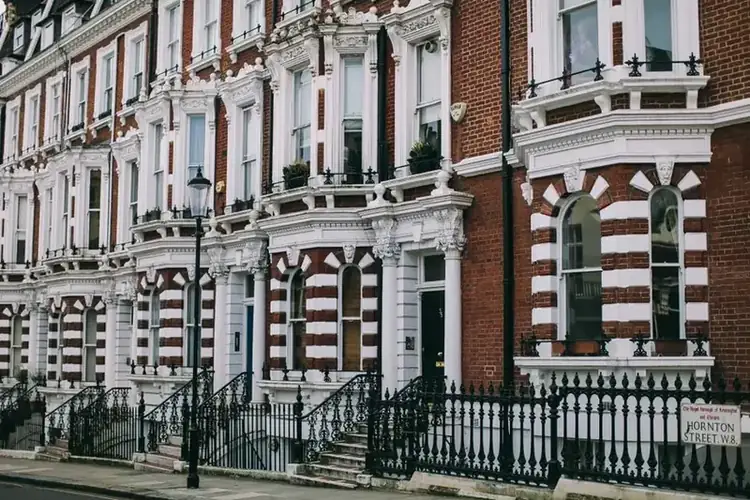 Row of adjoining terraced houses, where a loft conversion's floor has to control sound transmission through the shared party wall