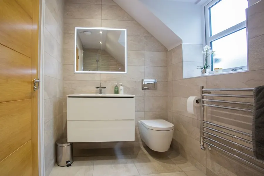Loft en-suite shower room with a sloping ceiling, a £2,500 to £5,000 addition on a Cornwall loft conversion