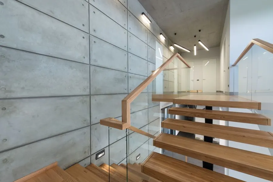 New staircase and landing in a modern home, showing the floor area a Cornish loft conversion stair takes from the storey below
