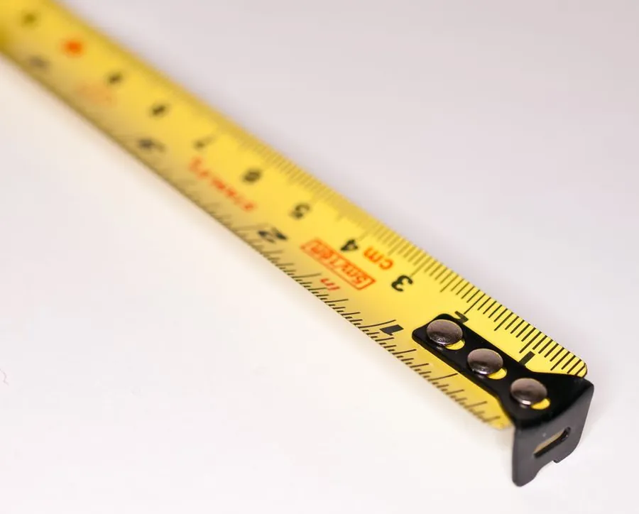 Metric tape measure used to check loft conversion headroom in a Cornish loft before a survey