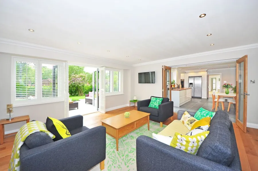 Open plan kitchen and living space looking onto a garden, the layout a rear extension delivers better than a loft