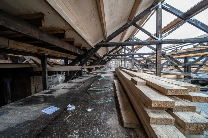 Exposed timber structure inside a loft under conversion, the kind of framing a structural engineer must assess