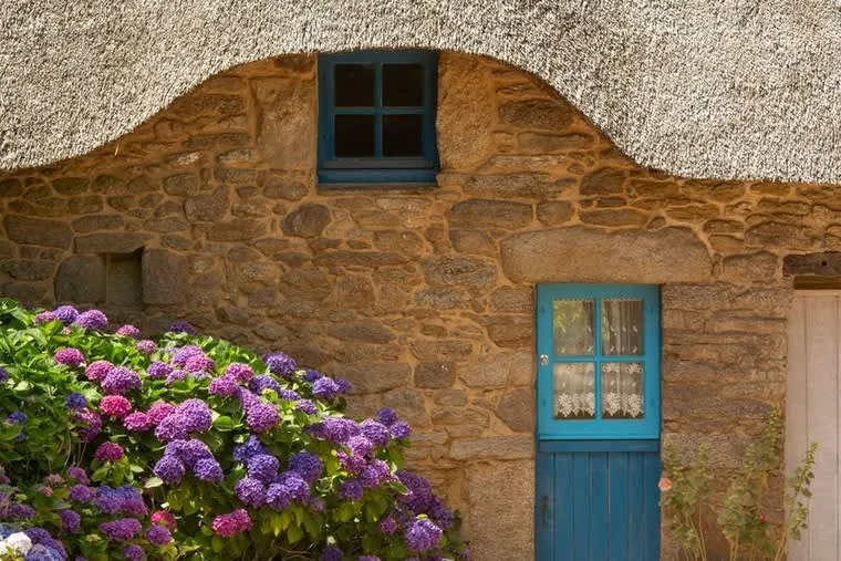 Cornish valley village of stone cottages inside a conservation area where dormer loft conversions need planning permission