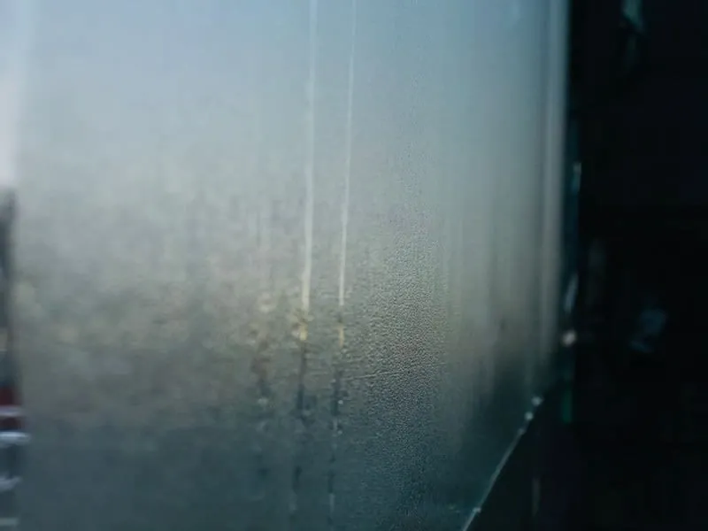Condensation running down a window, the first sign of a ventilation problem in a converted garage