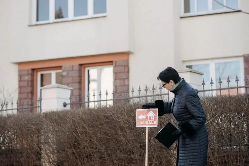 For sale sign outside a house, where a garage conversion's value uplift is finally tested