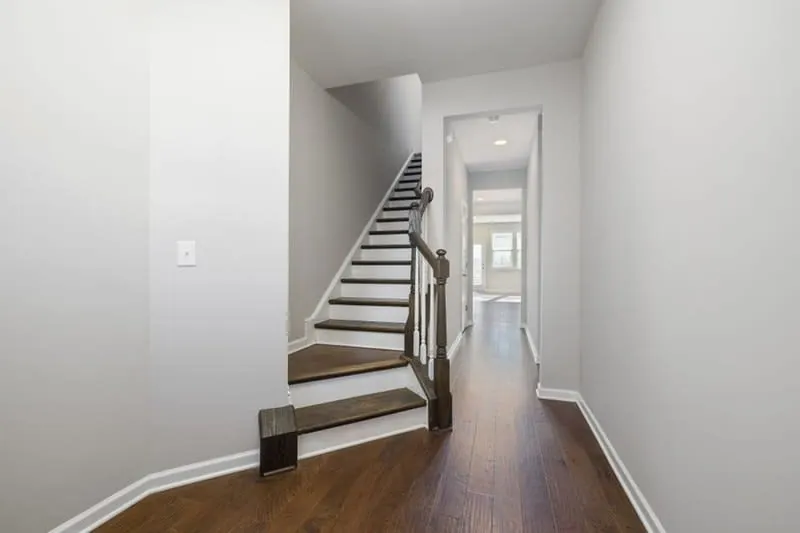 Finished staircase leading up to a converted loft room in a Cornish home