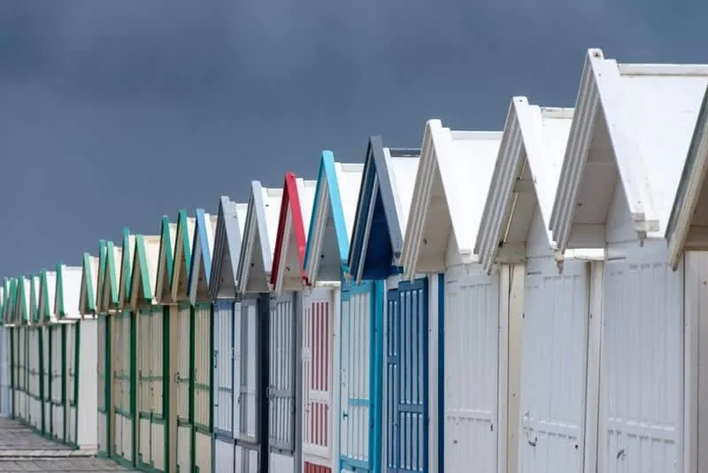 Stormy sky over a British seaside town, the weather that interrupts loft conversion work in Cornwall