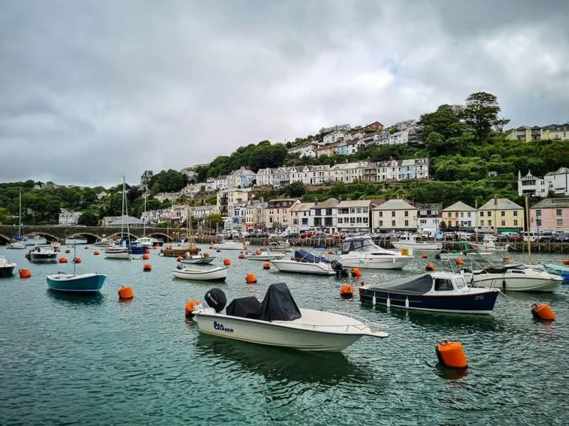 Cornish town houses built up a hillside above the harbour, typical of the county's older stock