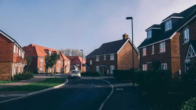 Cornish estate street with a car parked on the road, the situation a garage conversion can leave behind