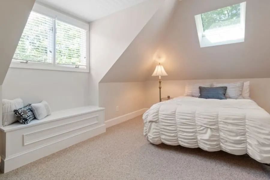Guest bedroom in a loft conversion with a rooflight above the bed