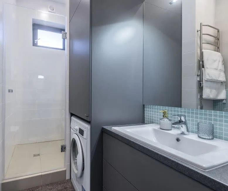 Compact en-suite shower room built into a loft conversion in Cornwall